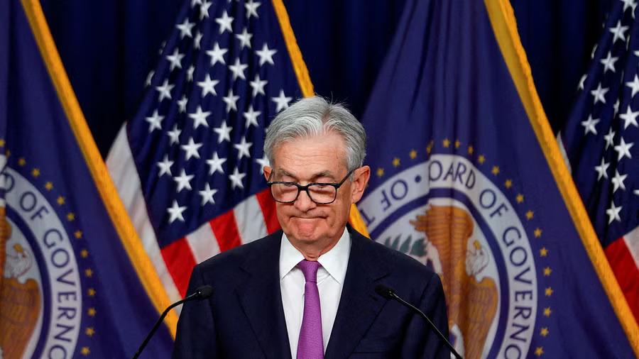 Fed officials leave rates unchanged and forecast three cuts next year