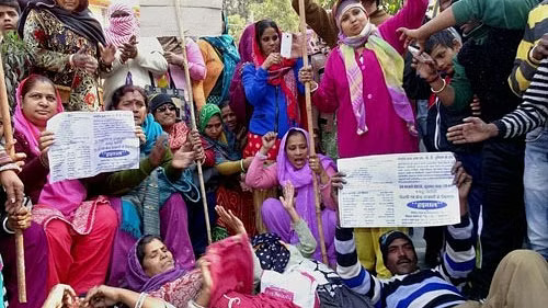 Sanitation workers protest outside MCD headquarters over pending arrears