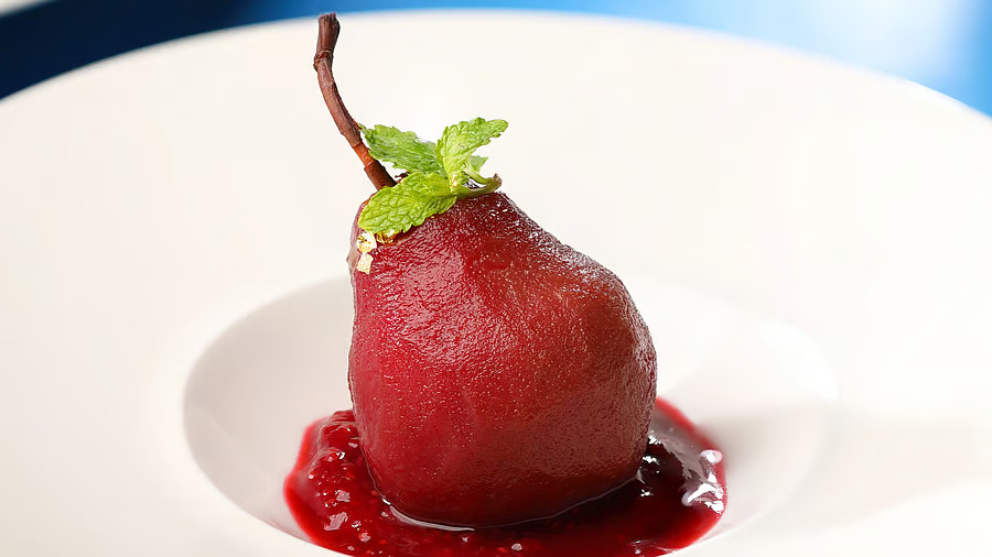 Chocolate-infused poached pear with vanilla quenelle